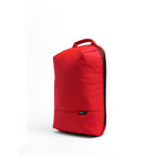 Mueslii small backpack, made of PU coated waterproof nylon, with a laptop compartment, color coral red, side view.