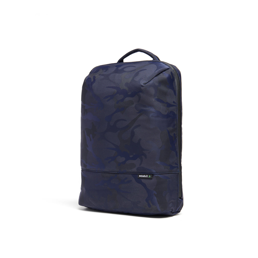 Mueslii daily backpack, made of jacquard  waterproof nylon, camouflage pattern, with a laptop compartment, color blue, side view.