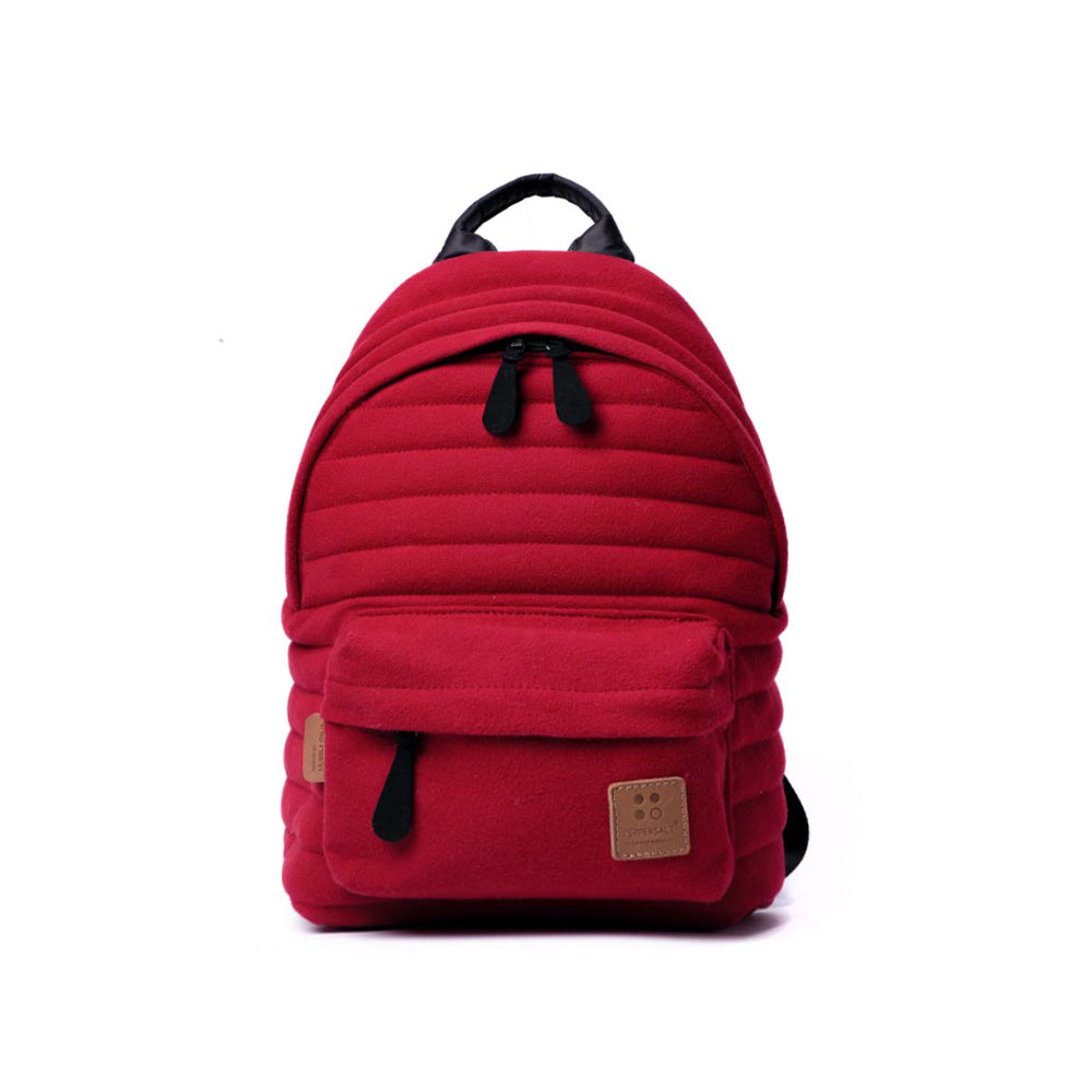 Mueslii original puffer small backpack made of woven cloth and Ykk zips, color red, front view.