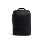 Mueslii travel backpack, made of PU coated waterproof nylon, with a laptop compartment, color coal black, front view.