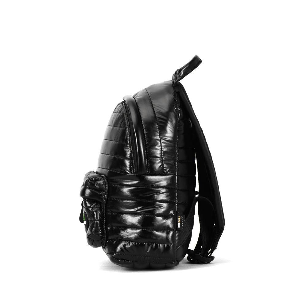 Mueslii original puffer medium and small backpack made of high density nylon and Ykk zips, color black, side view.