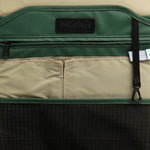Mueslii daily backpack, made of PU coated waterproof nylon, with a laptop compartment, color green, inside view.