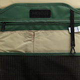 Mueslii small backpack, made of PU coated waterproof nylon, with a laptop compartment, color green, inside view.
