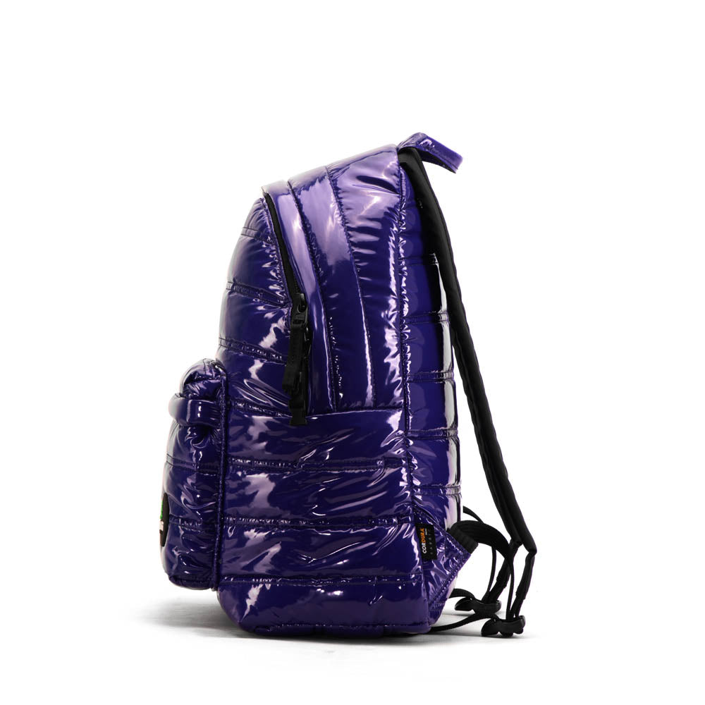 Mueslii original puffer daily backpack made of metal coated nylon and Ykk zips, color purple blue, side view.